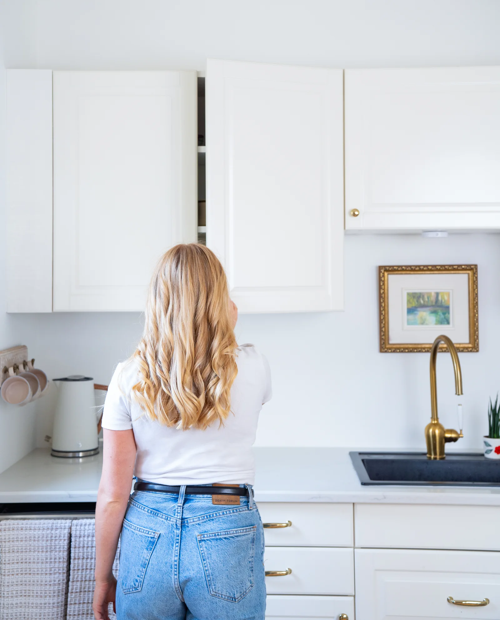 our skin-focused nutritionist opening her kitchen cabinet