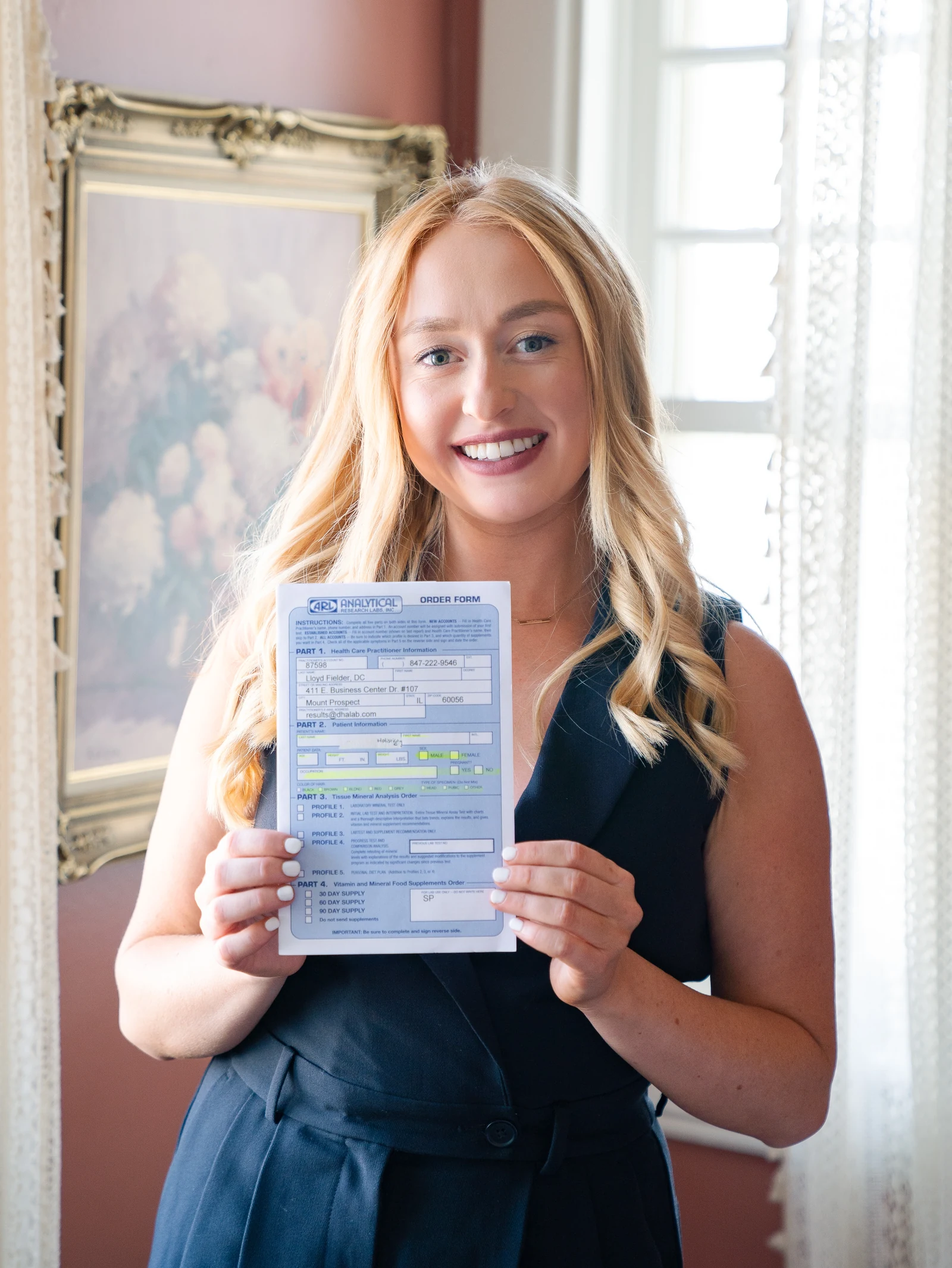 our skin-focused nutritionist holding an htma test